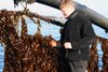 Engineering student Markus Platz is seen here with the seaweed harvester.