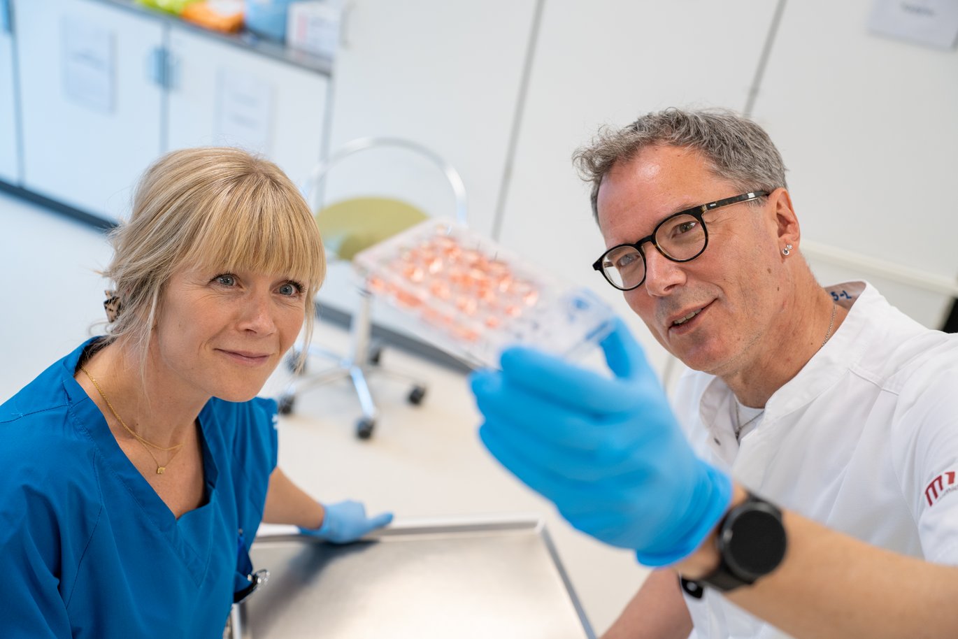 Physician and Associate Professor with one of the tissue samples that may be developed into a miniature intestine (gut organoid)